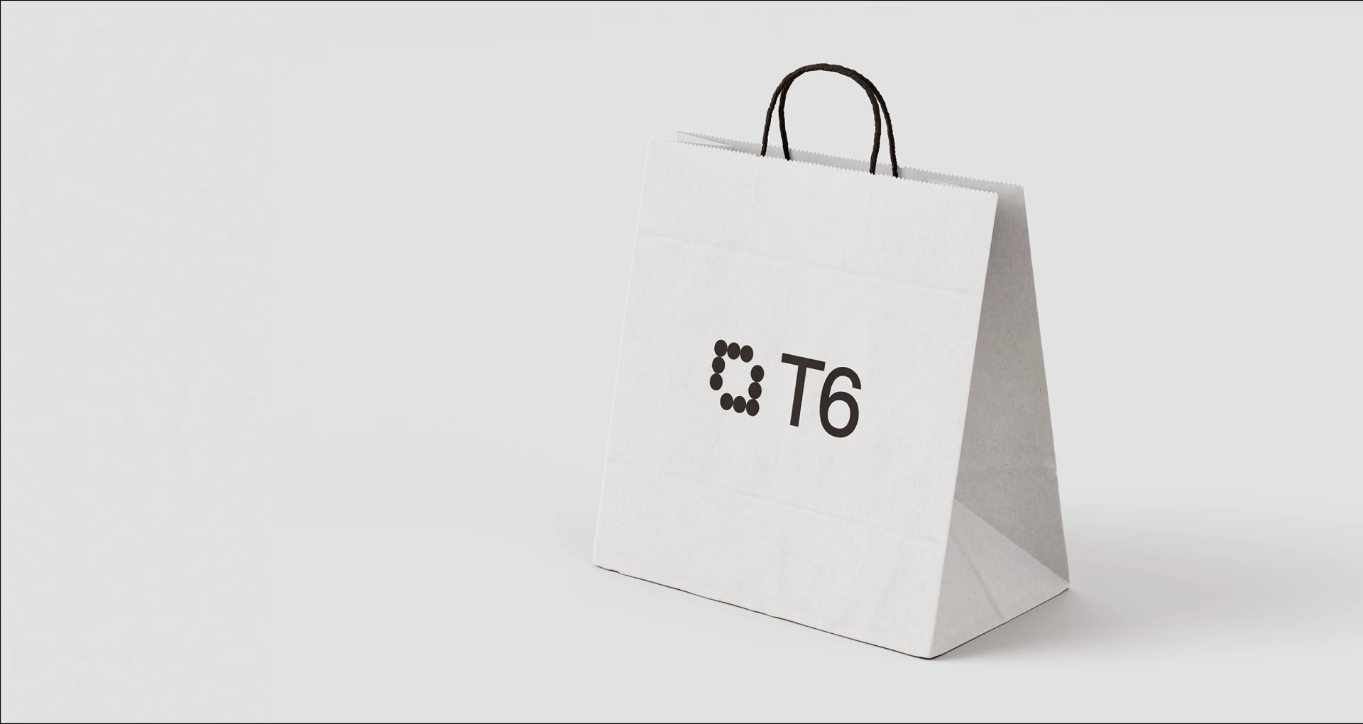 JFK Terminal 6 logo mark applied to a retail shopping bag.