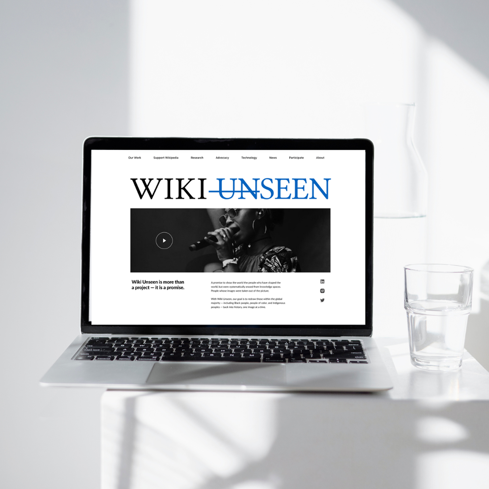 Wiki Unseen campaign page shown on a laptop.
