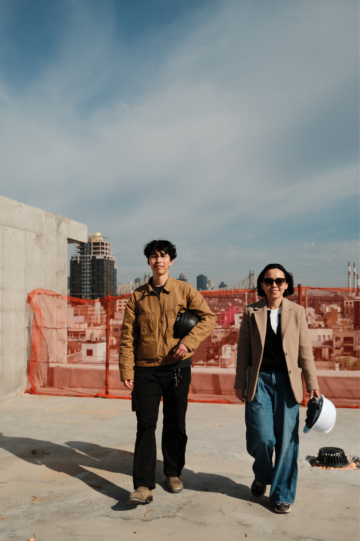 BuildFT team portrait on a rooftop construction site.