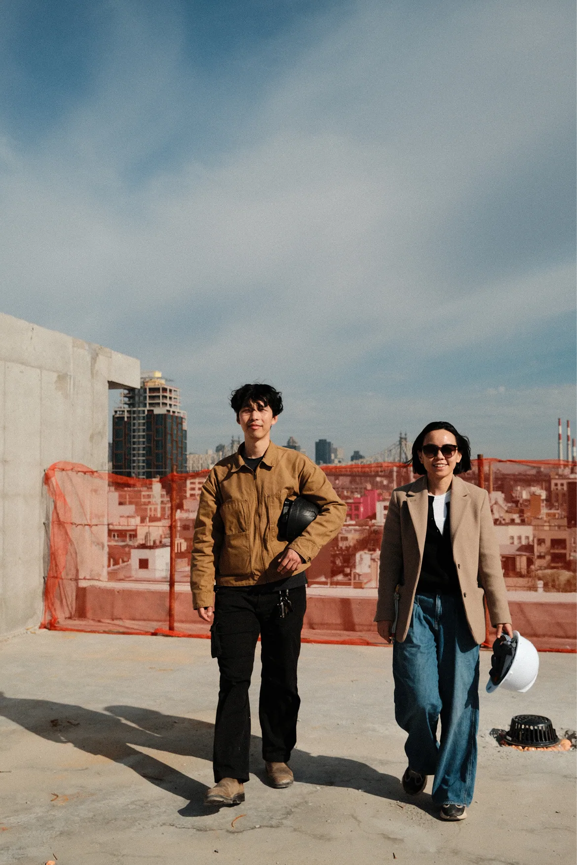 BuildFT team portrait on a rooftop construction site.