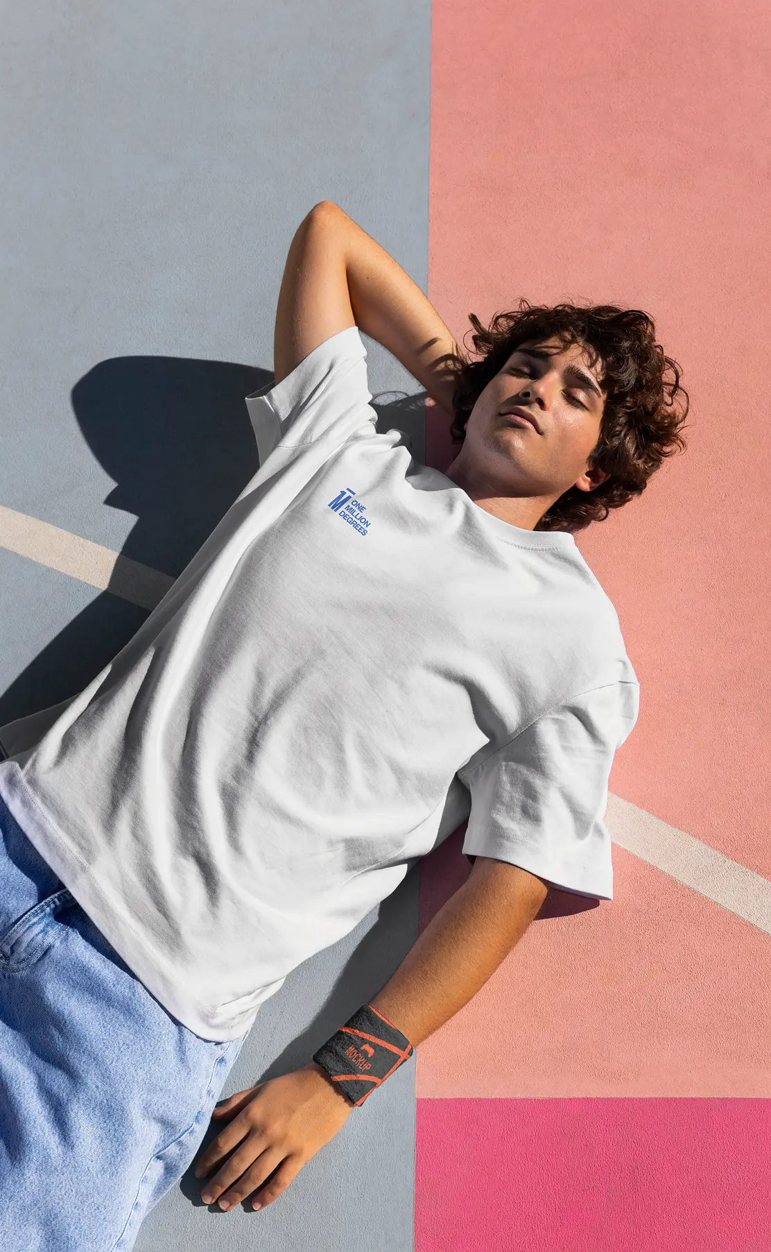 One Million Degrees branded t-shirt worn on a painted outdoor court.