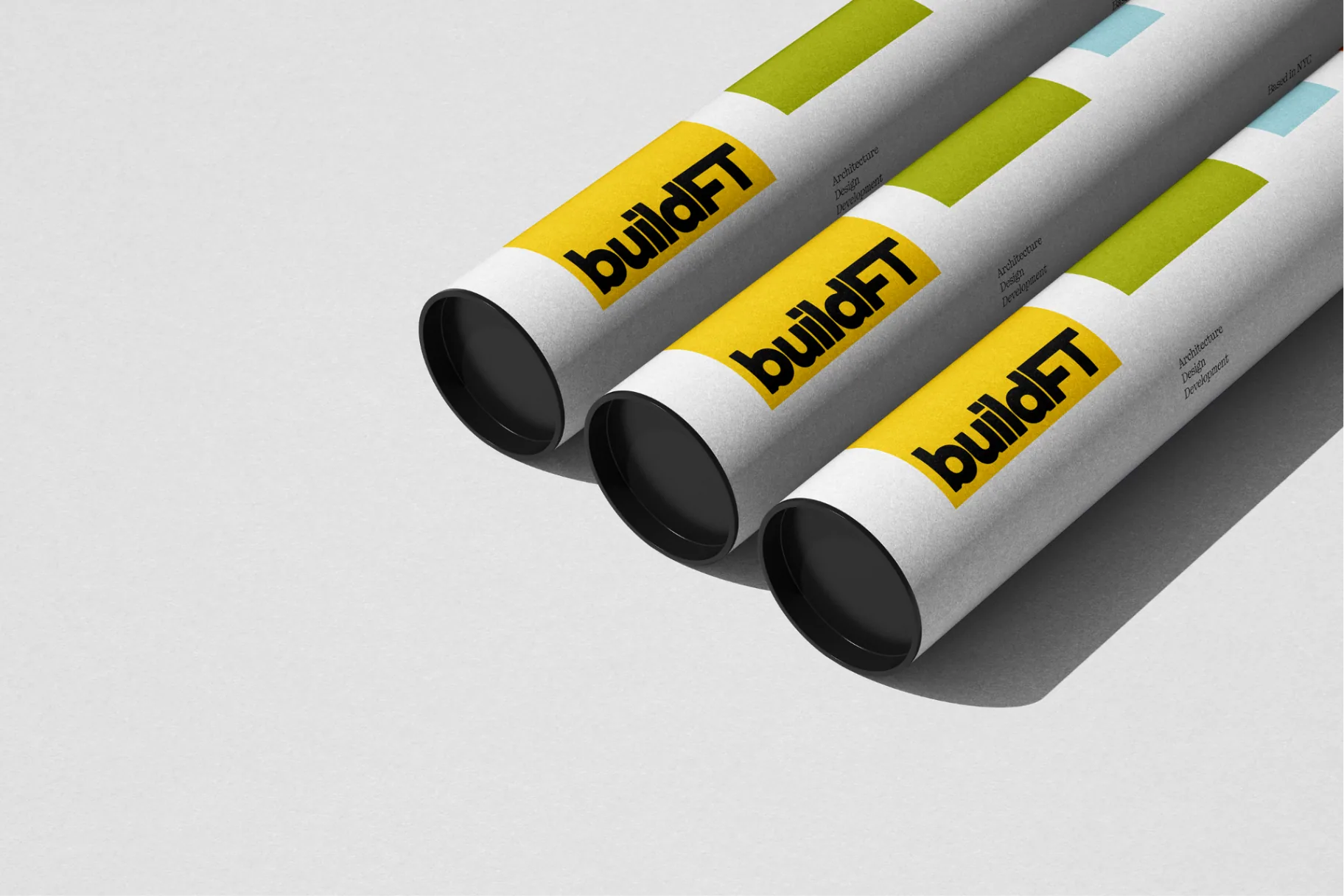 BuildFT blueprint tubes with brand system applied.