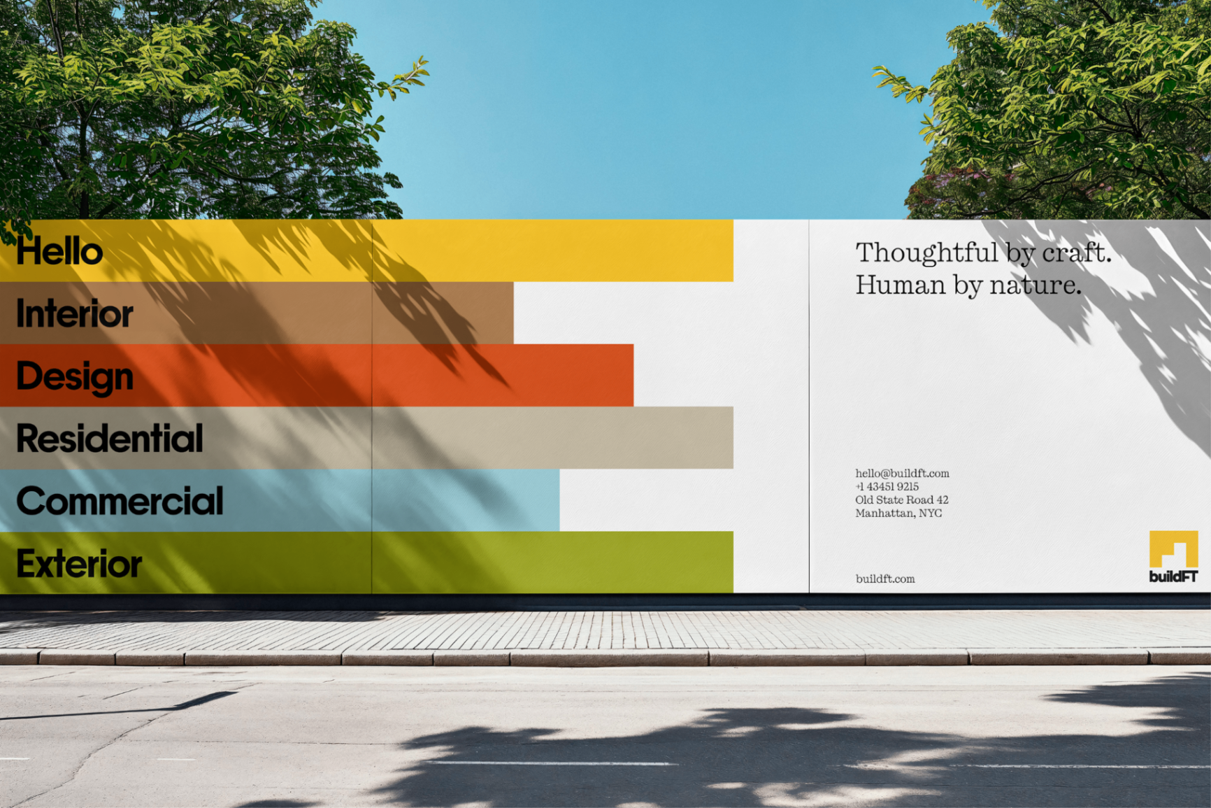 BuildFT large-format mural with colorful service bands and brand message.